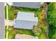 Aerial view of a well-maintained home showcasing lush greenery and mature trees on a spacious lot at 276 Gala Cir, Daytona Beach, FL 32124