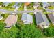 Aerial view showcasing the house nestled among other homes and green trees at 276 Gala Cir, Daytona Beach, FL 32124