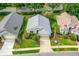 Aerial view of a well-maintained home with lush landscaping and mature trees at 276 Gala Cir, Daytona Beach, FL 32124