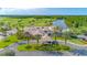 Aerial view of a beautiful community with a golf course, lake, and lush landscaping at 276 Gala Cir, Daytona Beach, FL 32124