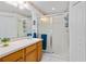 Bathroom features a vanity with a white countertop, a glass shower and white tiled walls at 276 Gala Cir, Daytona Beach, FL 32124