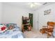 Small bedroom setup with bed, desk, and wood chair, offering a functional space at 276 Gala Cir, Daytona Beach, FL 32124