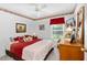 Bright bedroom featuring a ceiling fan, cozy decor, and a window with natural light at 276 Gala Cir, Daytona Beach, FL 32124