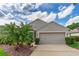 Charming home with a two-car garage, featuring well-kept landscaping and attractive curb appeal at 276 Gala Cir, Daytona Beach, FL 32124