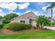 Inviting home exterior with lush front yard, including mature plantings and a well-manicured lawn at 276 Gala Cir, Daytona Beach, FL 32124