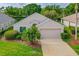 Charming single-story home featuring manicured landscaping and a two-car garage, perfect for comfortable living at 276 Gala Cir, Daytona Beach, FL 32124