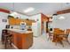 Open kitchen with a breakfast bar and access to the dining area and front entrance at 276 Gala Cir, Daytona Beach, FL 32124
