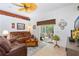 Relaxing living room with comfortable seating, tile flooring, ceiling fan, and access to outdoor patio at 276 Gala Cir, Daytona Beach, FL 32124