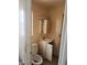This bathroom features a toilet, sink, and a vanity at 2810 Kumquat Dr, Edgewater, FL 32141