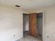 Neutral toned bedroom with closet and laminate flooring awaiting renovation at 2810 Kumquat Dr, Edgewater, FL 32141
