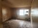 Empty bedroom featuring tile flooring, a large window and neutral-toned walls at 2810 Kumquat Dr, Edgewater, FL 32141