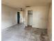 Vacant living room with tile flooring and neutral paint, awaiting renovation at 2810 Kumquat Dr, Edgewater, FL 32141
