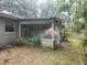 This screened-in patio offers an outdoor space for relaxation and enjoyment at 2810 Kumquat Dr, Edgewater, FL 32141