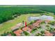 Aerial view of home with a pond and golf course. The location of the property is marked with an arrow at 2814 S Asciano Ct, New Smyrna Beach, FL 32168