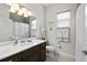 Well-lit bathroom featuring a shower with a curtain and a decorative turtle theme at 2814 S Asciano Ct, New Smyrna Beach, FL 32168