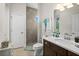 Bathroom featuring a dark wood vanity and tiled standing shower at 2814 S Asciano Ct, New Smyrna Beach, FL 32168