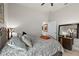 Comfortable bedroom with patterned bedding and a dark wood dresser at 2814 S Asciano Ct, New Smyrna Beach, FL 32168