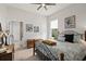 Cozy bedroom featuring a wrought iron bed frame and ensuite bathroom access at 2814 S Asciano Ct, New Smyrna Beach, FL 32168