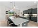 Island kitchen with granite countertop, stainless steel appliances, and large window at 2814 S Asciano Ct, New Smyrna Beach, FL 32168