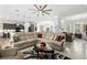 Expansive living room featuring a large sectional sofa and modern decor with lots of natural light at 2814 S Asciano Ct, New Smyrna Beach, FL 32168
