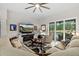 Inviting living room featuring comfortable seating, a fireplace, and sliding glass doors to the backyard at 2814 S Asciano Ct, New Smyrna Beach, FL 32168