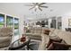 Cozy living room with comfortable seating, modern decor, and an open view to the kitchen at 2814 S Asciano Ct, New Smyrna Beach, FL 32168