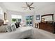 Bright main bedroom with large dresser and seating area, offering a peaceful retreat at 2814 S Asciano Ct, New Smyrna Beach, FL 32168
