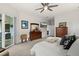 Spacious main bedroom featuring a large dresser and access to the outdoor patio at 2814 S Asciano Ct, New Smyrna Beach, FL 32168