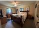 Comfortable bedroom featuring ample natural light, ceiling fan, and plenty of room for relaxation at 2816 Travelers Palm Dr, Edgewater, FL 32141