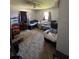 Functional bedroom features carpet, neutral paint, ceiling fan, and two windows at 2816 Travelers Palm Dr, Edgewater, FL 32141