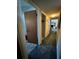 Hallway connecting to rooms featuring well-lit space, neutral tones, and easy navigation at 2816 Travelers Palm Dr, Edgewater, FL 32141