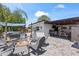 Backyard with an outdoor kitchen, fire pit, pool and seating area at 2824 Oak Lea Dr, South Daytona, FL 32119