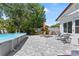 Backyard featuring a pool, brick pavers and lounge furniture at 2824 Oak Lea Dr, South Daytona, FL 32119