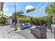 Backyard area features brick pavers, seating and shade at 2824 Oak Lea Dr, South Daytona, FL 32119