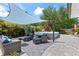Backyard featuring covered patio seating, above ground pool and paver patio at 2824 Oak Lea Dr, South Daytona, FL 32119