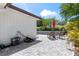 The backyard features a swimming pool with chairs, beautiful greenery and a brick patio at 2824 Oak Lea Dr, South Daytona, FL 32119