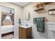 Bathroom with a single sink vanity, toilet, and access to the bedroom at 2824 Oak Lea Dr, South Daytona, FL 32119