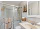 Bathroom featuring a shower with glass doors and tiled walls at 2824 Oak Lea Dr, South Daytona, FL 32119