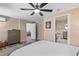 Well-lit bedroom offers a ceiling fan and access to the bathroom and other rooms at 2824 Oak Lea Dr, South Daytona, FL 32119