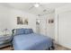 Cozy bedroom features modern decor, a picture and a closet at 2824 Oak Lea Dr, South Daytona, FL 32119