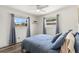 Bright bedroom featuring dual windows, contemporary decor, and blue accents at 2824 Oak Lea Dr, South Daytona, FL 32119