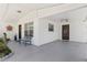 Inviting covered patio area with brick accents, bench, and easy access to the front door at 2824 Oak Lea Dr, South Daytona, FL 32119