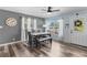 Modern dining room with hardwood floors, stylish table set, and natural light at 2824 Oak Lea Dr, South Daytona, FL 32119