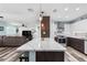 Modern kitchen with quartz countertops, stainless steel appliances and an island with seating at 2824 Oak Lea Dr, South Daytona, FL 32119