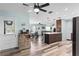 Spacious open floor plan featuring a modern kitchen with a kitchen island and bar and a dining area at 2824 Oak Lea Dr, South Daytona, FL 32119