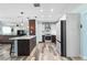 Modern kitchen featuring an open floor plan with stainless appliances, kitchen island and open access to the living room at 2824 Oak Lea Dr, South Daytona, FL 32119