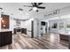 Open-concept kitchen and living area with sleek appliances, ample counter space, and stylish modern design at 2824 Oak Lea Dr, South Daytona, FL 32119