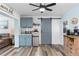 Open floor plan featuring a bar area, mini fridge and a sliding barn door at 2824 Oak Lea Dr, South Daytona, FL 32119