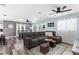 Bright and airy living room with comfortable seating, hardwood floors and views of the dining area at 2824 Oak Lea Dr, South Daytona, FL 32119