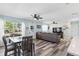 Open-concept living space featuring a stylish dining area, sofa and a connecting Kitchen at 2824 Oak Lea Dr, South Daytona, FL 32119